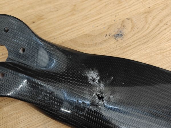 Carbon-fibre UAV propeller blade with a punched-through, delaminated impact hole